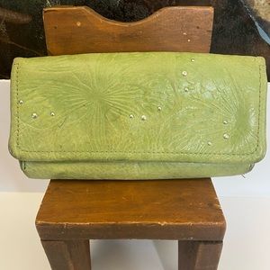 Fossil butterfly embossed leather wallet with rivets.